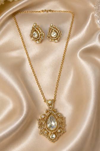 Elegant gold-tone teardrop pendant necklace set with matching stud earrings
