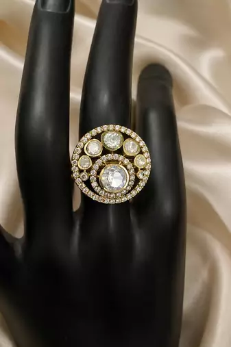 Elegant gold-tone round statement ring with clear stone studded design