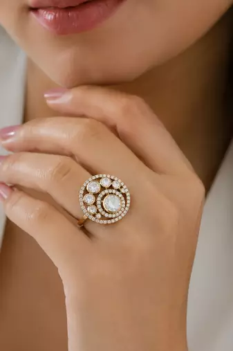 Elegant gold-tone round statement ring with clear stone studded design