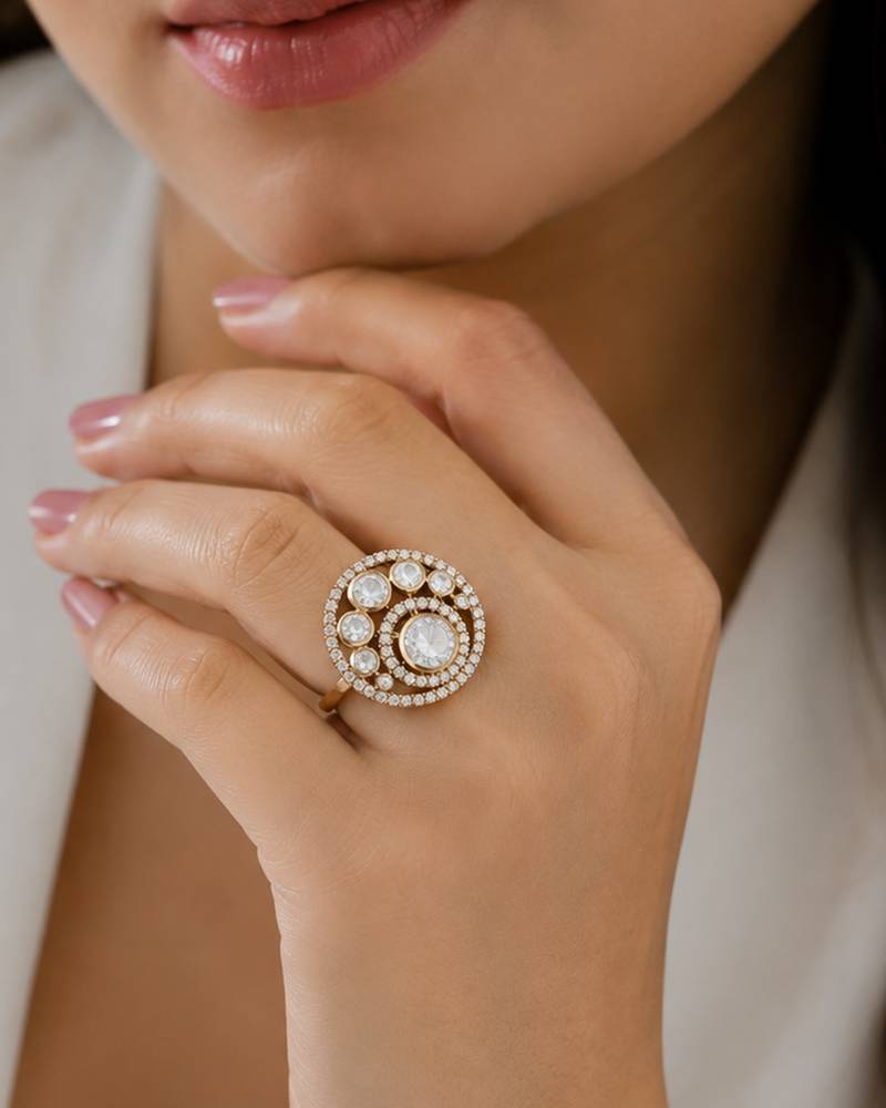 Elegant gold-tone round statement ring with clear stone studded design