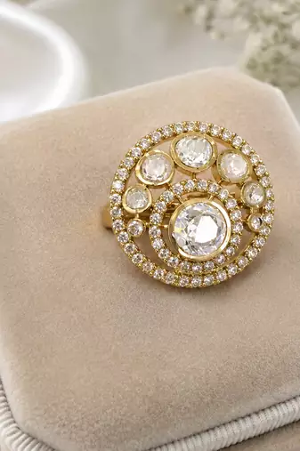 Elegant gold-tone round statement ring with clear stone studded design