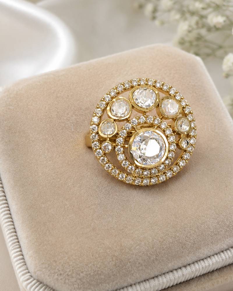 Elegant gold-tone round statement ring with clear stone studded design