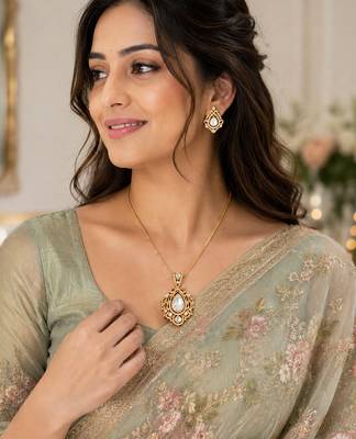 Elegant gold-tone teardrop pendant necklace set with matching stud earrings 3