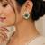 Emerald green teardrop stone gold-tone studded earrings