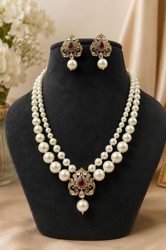 Elegant pearl beaded necklace set with ruby-coloured stones & kundan work