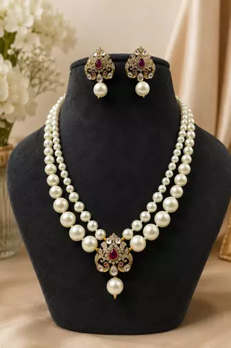 Elegant pearl beaded necklace set with ruby-coloured stones & kundan work