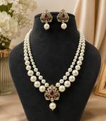 Elegant pearl beaded necklace set with ruby-coloured stones & kundan work