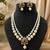 Elegant pearl beaded necklace set with ruby-coloured stones & kundan work