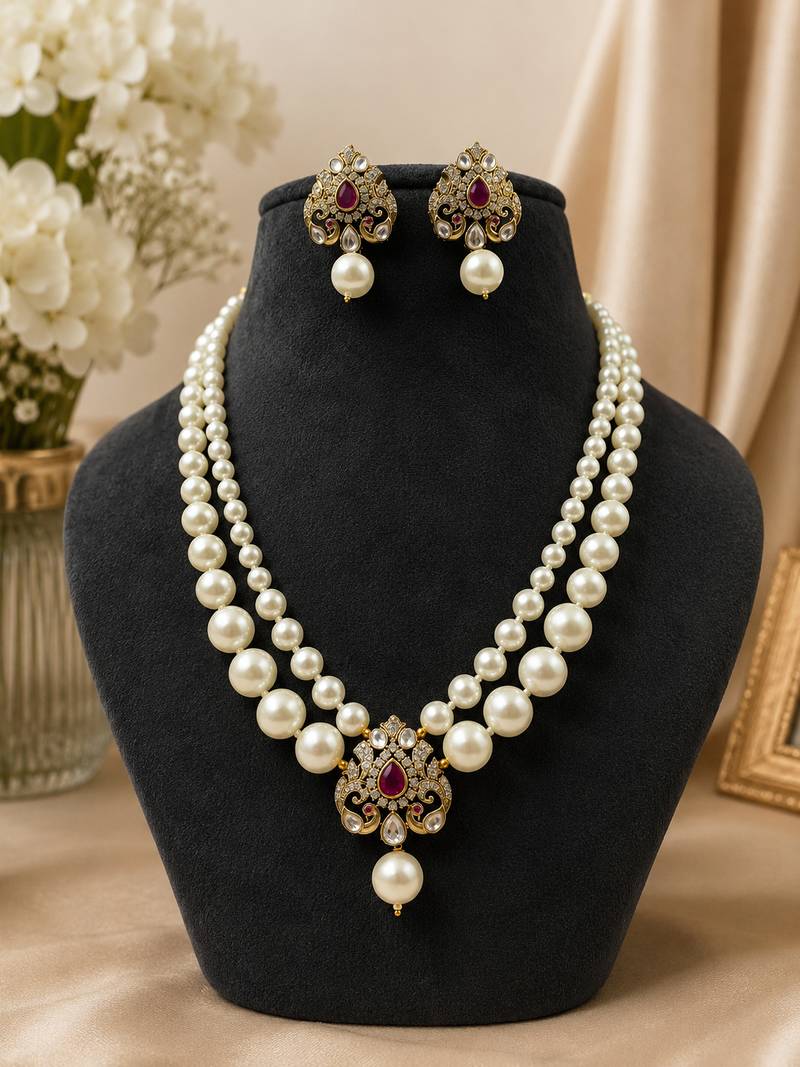 Elegant pearl beaded necklace set with ruby-coloured stones & kundan work