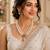 Elegant pearl beaded necklace set with ruby-coloured stones & kundan work