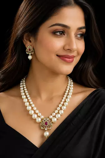 Elegant pearl beaded necklace set with ruby-coloured stones & kundan work