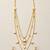 Elegant gold tone multi-layer necklace set with white stone pendant & drop earrings