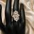 Elegant gold-plated floral cluster statement ring with clear stones