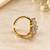 Elegant gold-plated floral cluster statement ring with clear stones