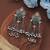 Green color dual tone oxidised dangle earrings
