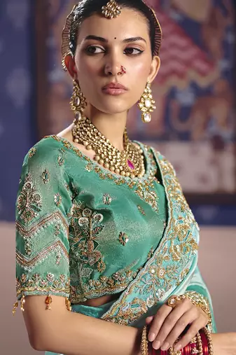 turquoise  tissue heavy embroidery designer saree