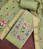 Green banarasi cotton woven design unstitched dress material.