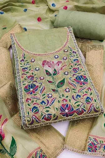 Green banarasi cotton woven design unstitched dress material.