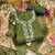 Green linen cotton printed unstitched dress material.