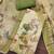 Green linen cotton printed unstitched dress material.