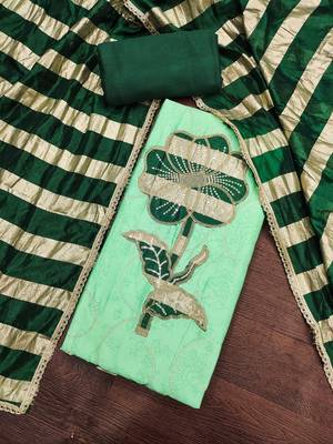 Green cotton embroidered unstitched dress material. 1