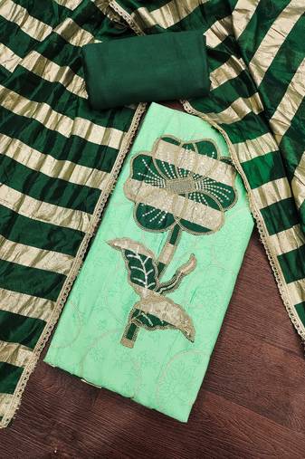 Green cotton embroidered unstitched dress material.