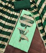 Green cotton embroidered unstitched dress material.