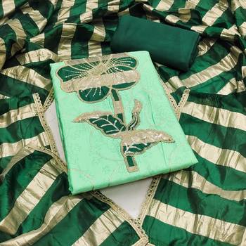 Green cotton embroidered unstitched dress material. 2