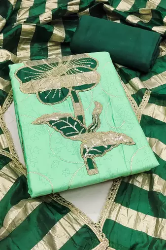 Green cotton embroidered unstitched dress material.