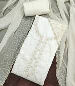 White cotton embroidered unstitched dress material.