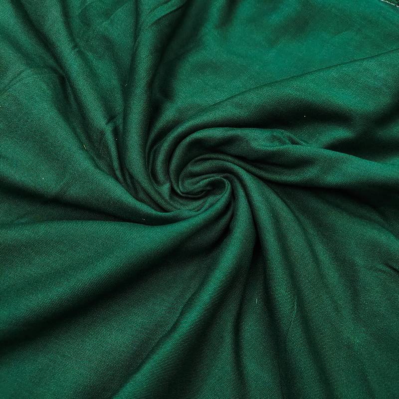 Green cotton embroidered unstitched dress material.