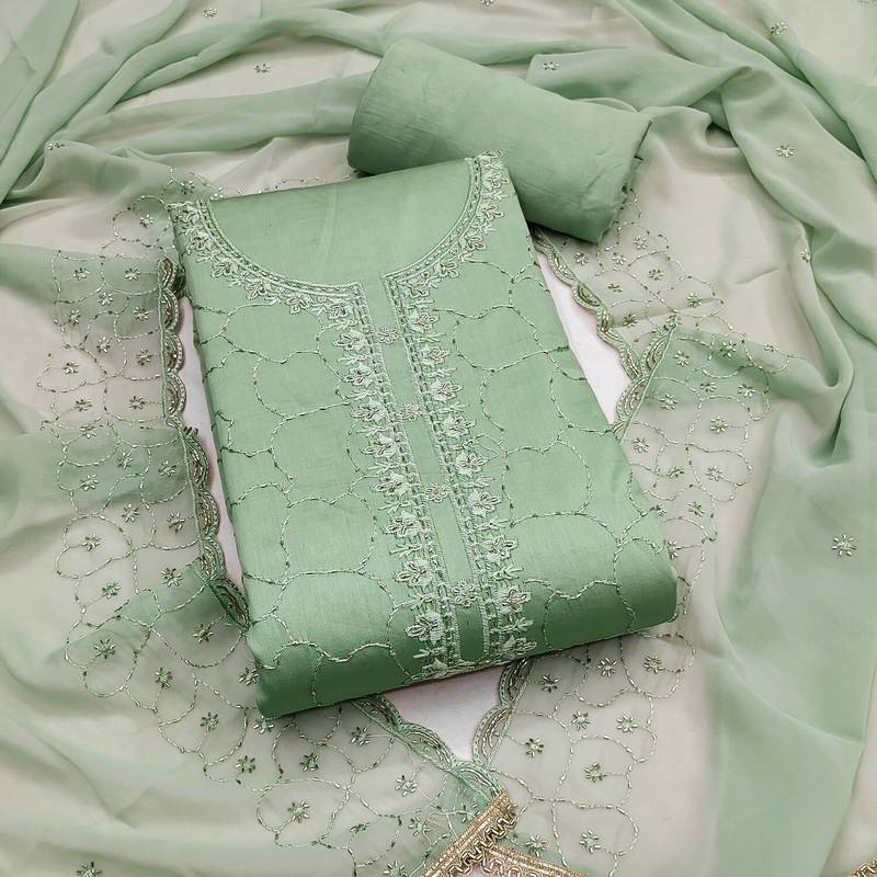 Sea green cotton embroidered unstitched dress material.