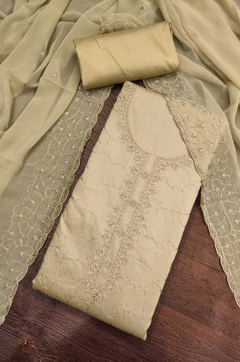 beige cotton embroidered unstitched dress material.