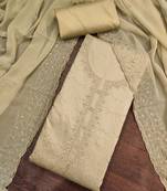 beige cotton embroidered unstitched dress material.