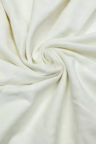 White cotton embroidered unstitched dress material.