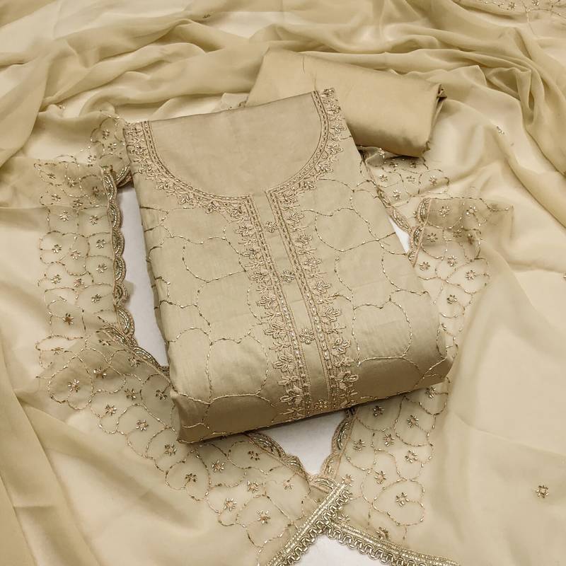 beige cotton embroidered unstitched dress material.