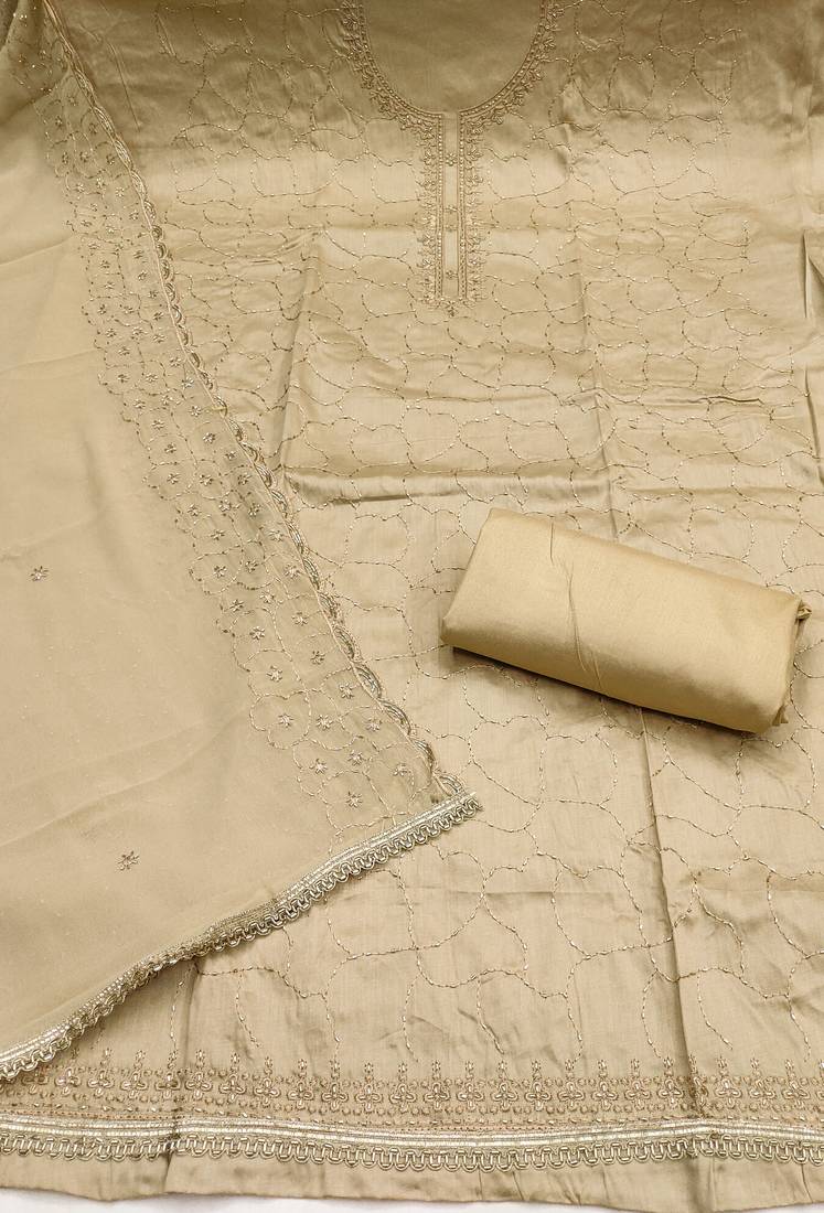 beige cotton embroidered unstitched dress material.
