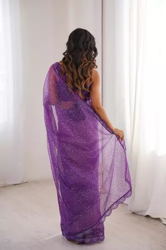 Purple net sequins work embroidered saree