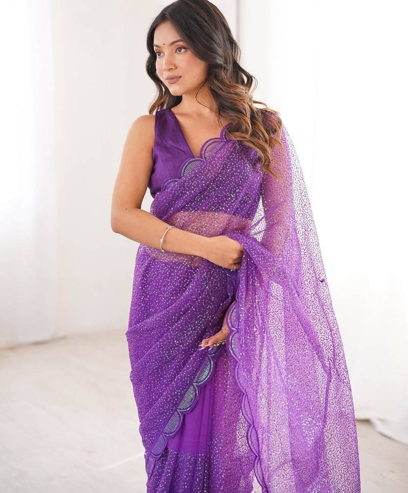 Purple net sequins work embroidered saree