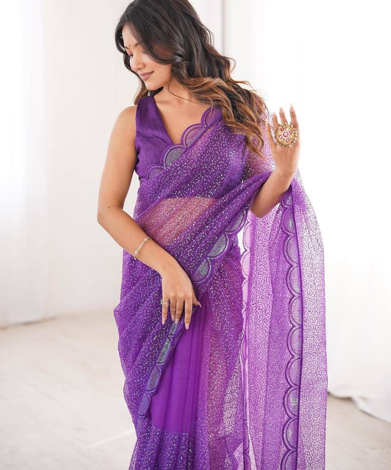 Purple net sequins work embroidered saree