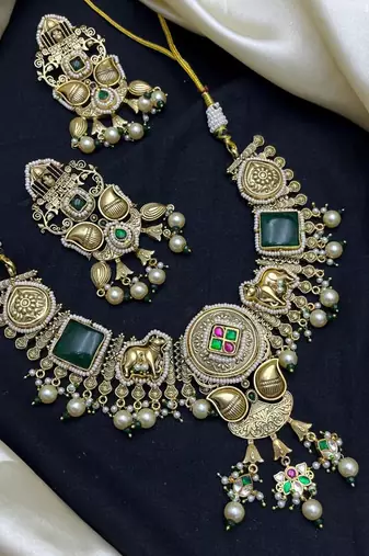 antique gold temple jewelry set with choker necklace and jhumka earrings