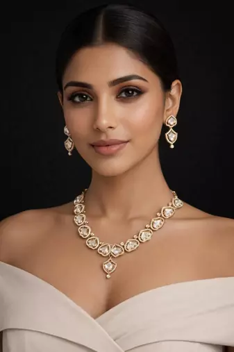 gold heart-shaped kundan necklace set with earrings