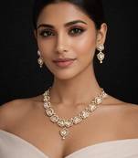 gold heart-shaped kundan necklace set with earrings