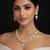 gold heart-shaped kundan necklace set with earrings