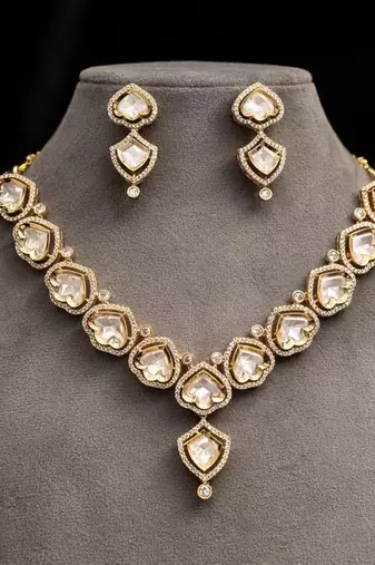 gold heart-shaped kundan necklace set with earrings