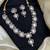 gold heart-shaped kundan necklace set with earrings