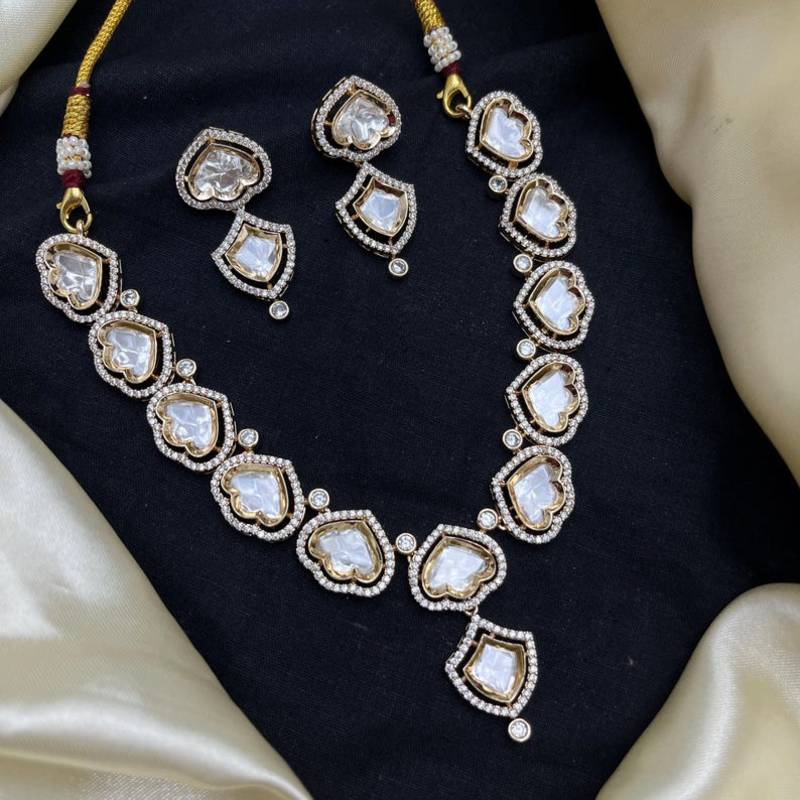 gold heart-shaped kundan necklace set with earrings