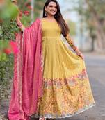 Yellow luxrious elegant position print embroidered gown paired with a contrast dupatta