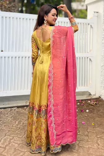Yellow luxrious elegant position print embroidered gown paired with a contrast dupatta