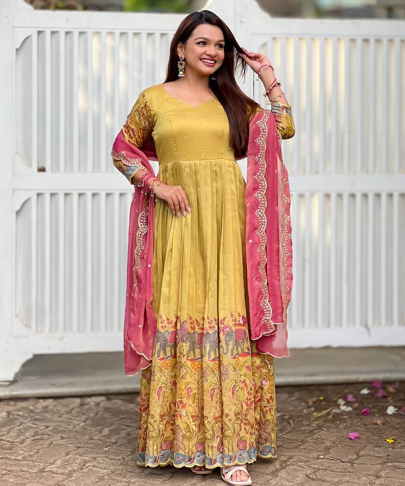 Yellow luxrious elegant position print embroidered gown paired with a contrast dupatta